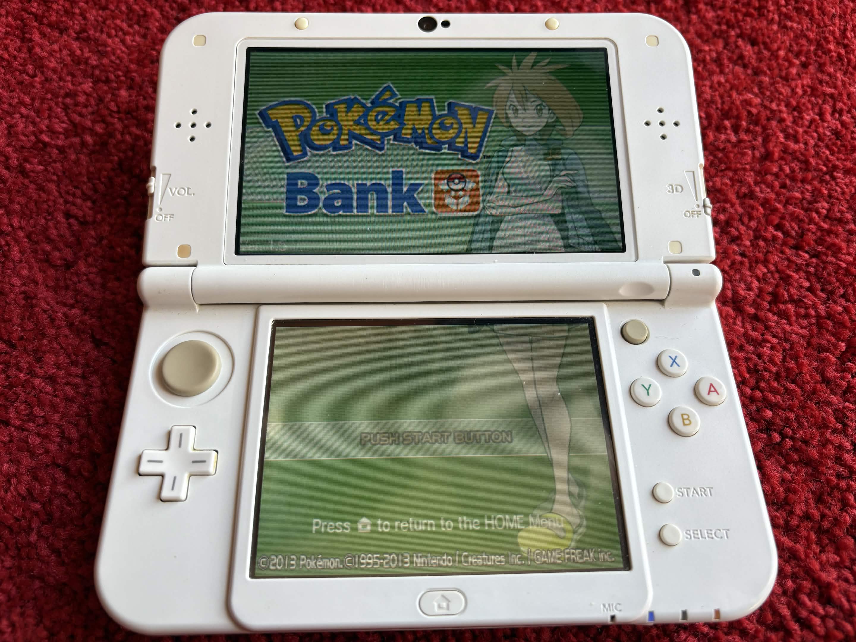 A Nintendo 3DS console displaying Pokémon Bank software