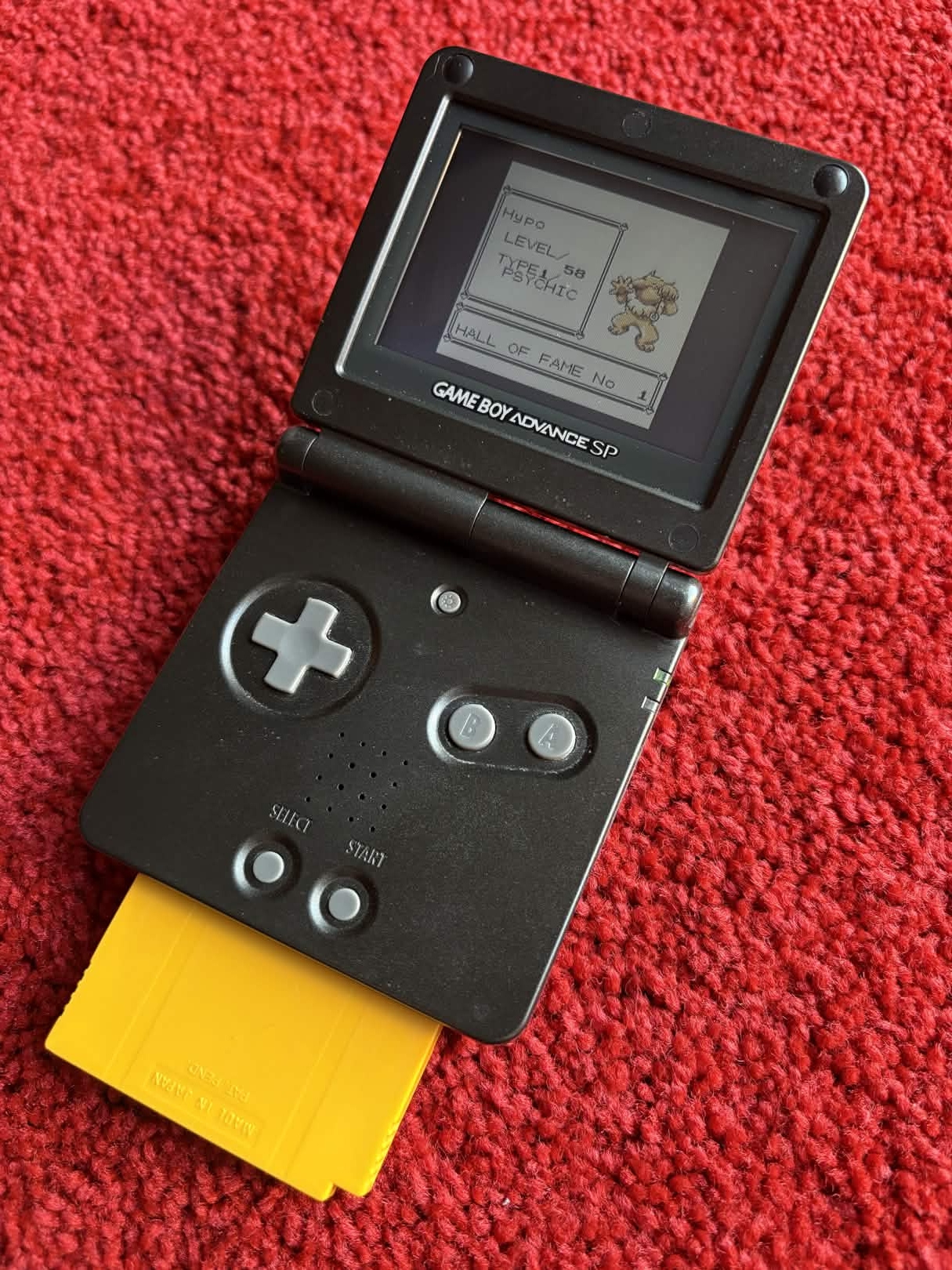 Pokémon Yellow running on a Game Boy Advance SP device