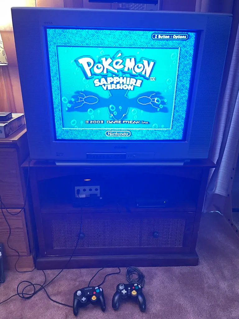 A photo of Pokémon Sapphire on an older television